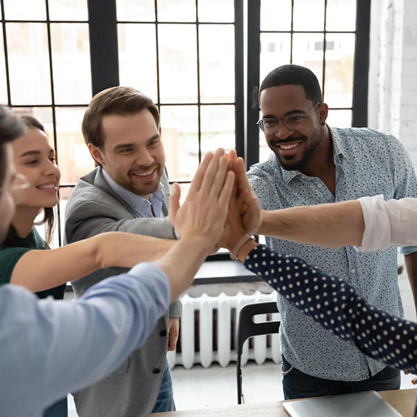 a group of people raising their hands